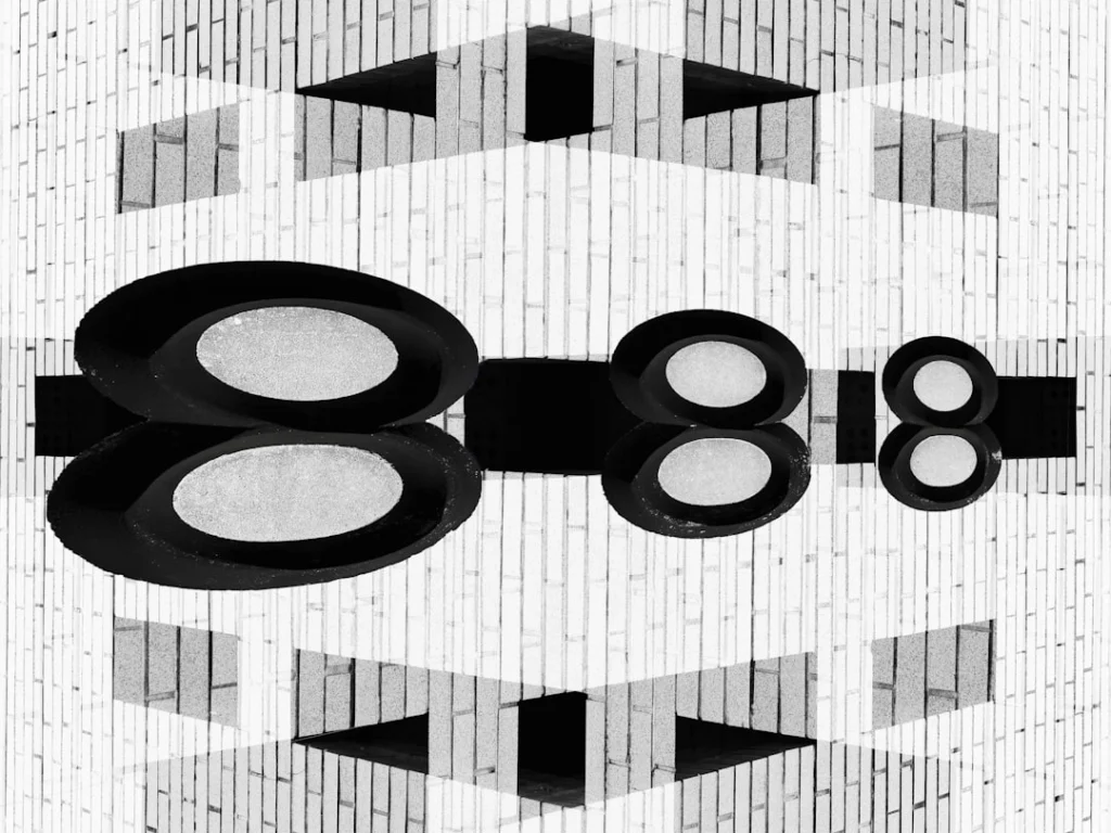 Abstract geometric pattern with oval shapes and reflections.