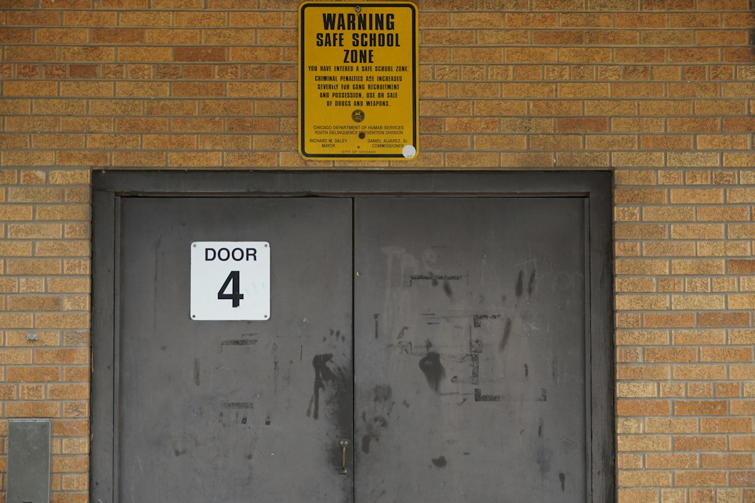 Double doors with "door 4" sign and warning sign